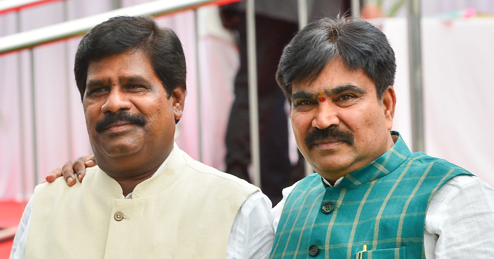 In this June 14, 2019 file photo, independent MLAs R. Shankar (right) and H. Nagesh are seen during the cabinet expansion of JD(S)-Congress coalition government, in Bengaluru. 