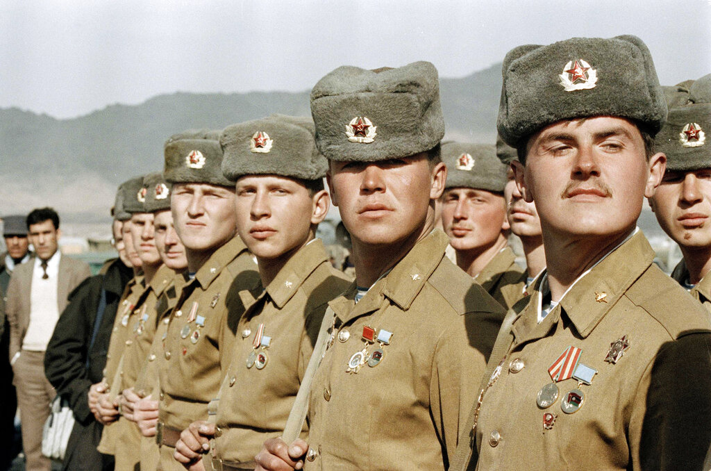 In this photo taken on February 13, 1989, the last Soviet unit stands stationary during a military parade on the tarmac of Kabul airport, just before leaving Afghanistan for the last time. The Soviet intervention drew strong international condemnation and imposed a heavy burden on the struggling Soviet economy. Soviet leader Mikhail Gorbachev ordered the pullout amid his efforts to conduct liberal reforms and end confrontation with the West.