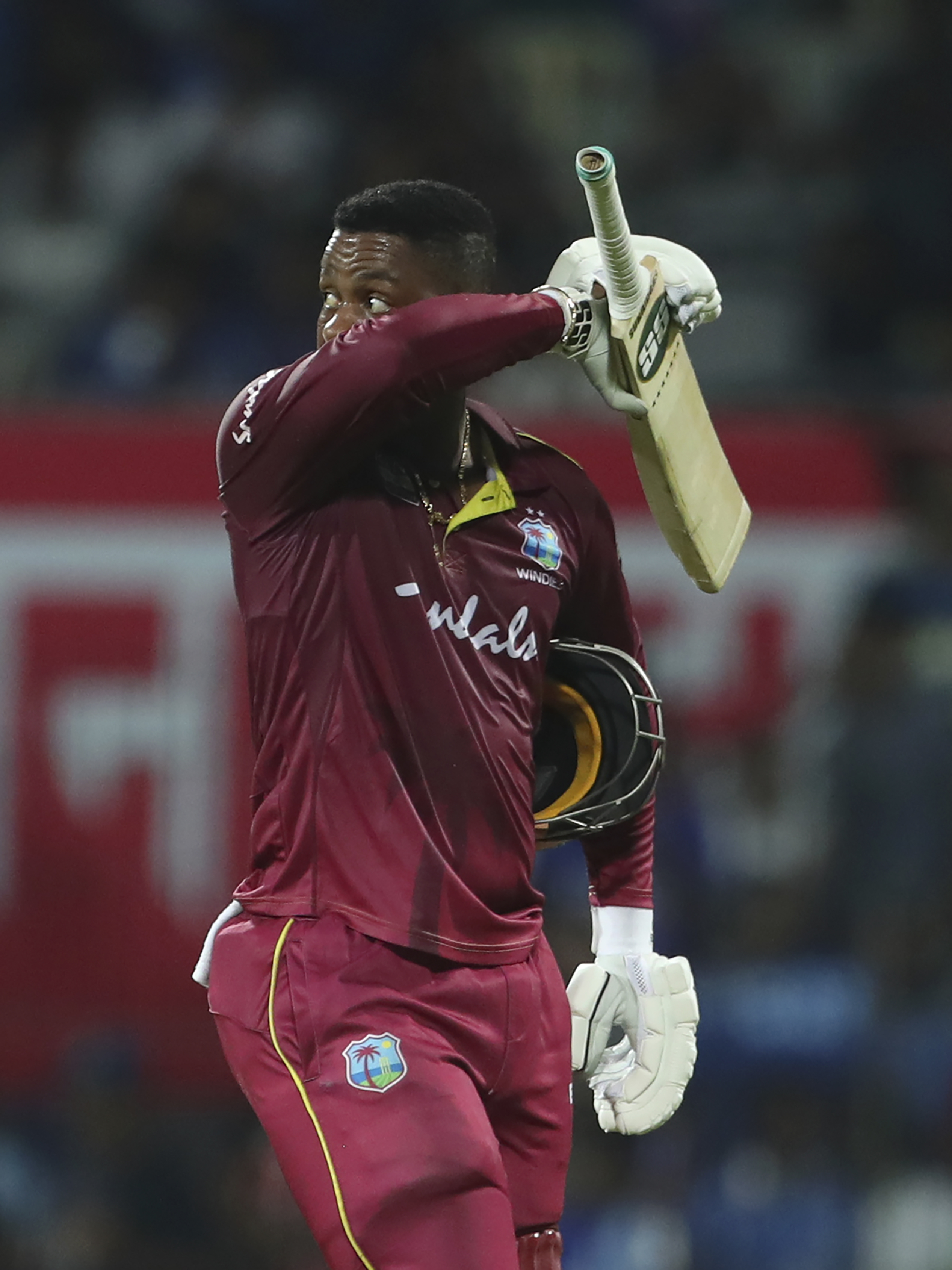 Shimron Hetmyer looks back to watch the replay of his dismissal as he leaves the field during the first one day international cricket match between India and West Indies in Chennai, India, on December 15, 2019