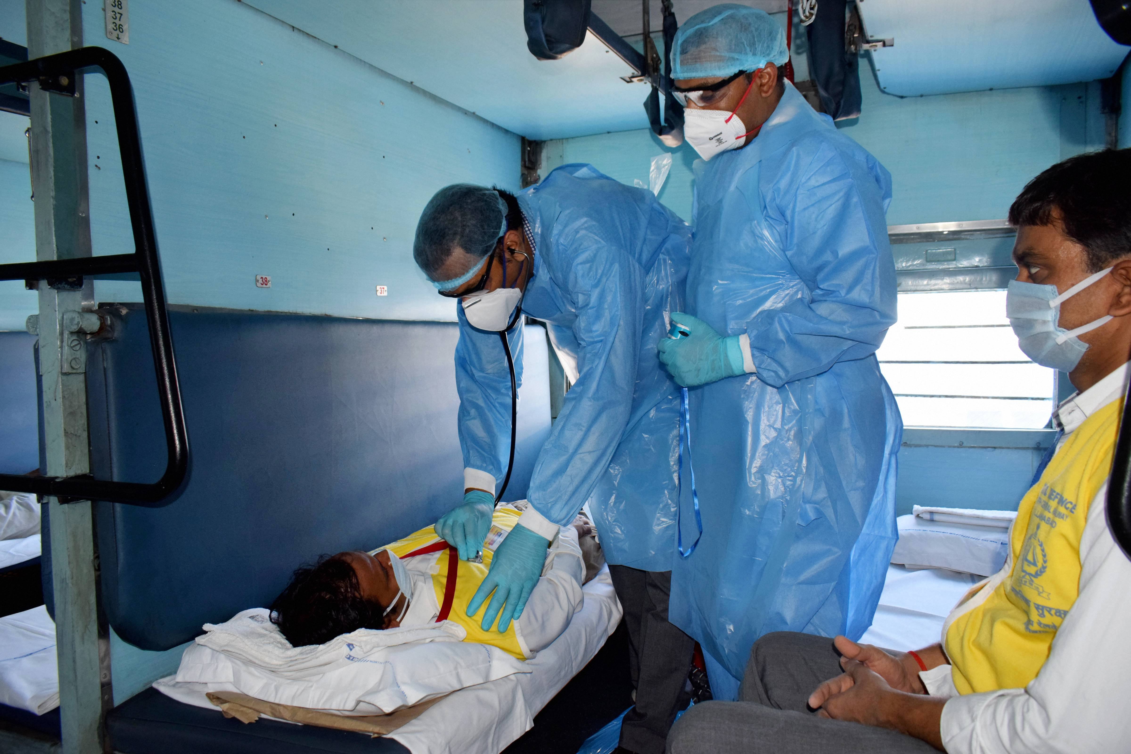 Doctors conduct a mock drill inside a train coach converted into isolation ward for COVID 19 patients, during the nationwide lockdown in the wake of coronavirus pandemic, at a railway station in Prayagraj, Friday, April 24, 2020
