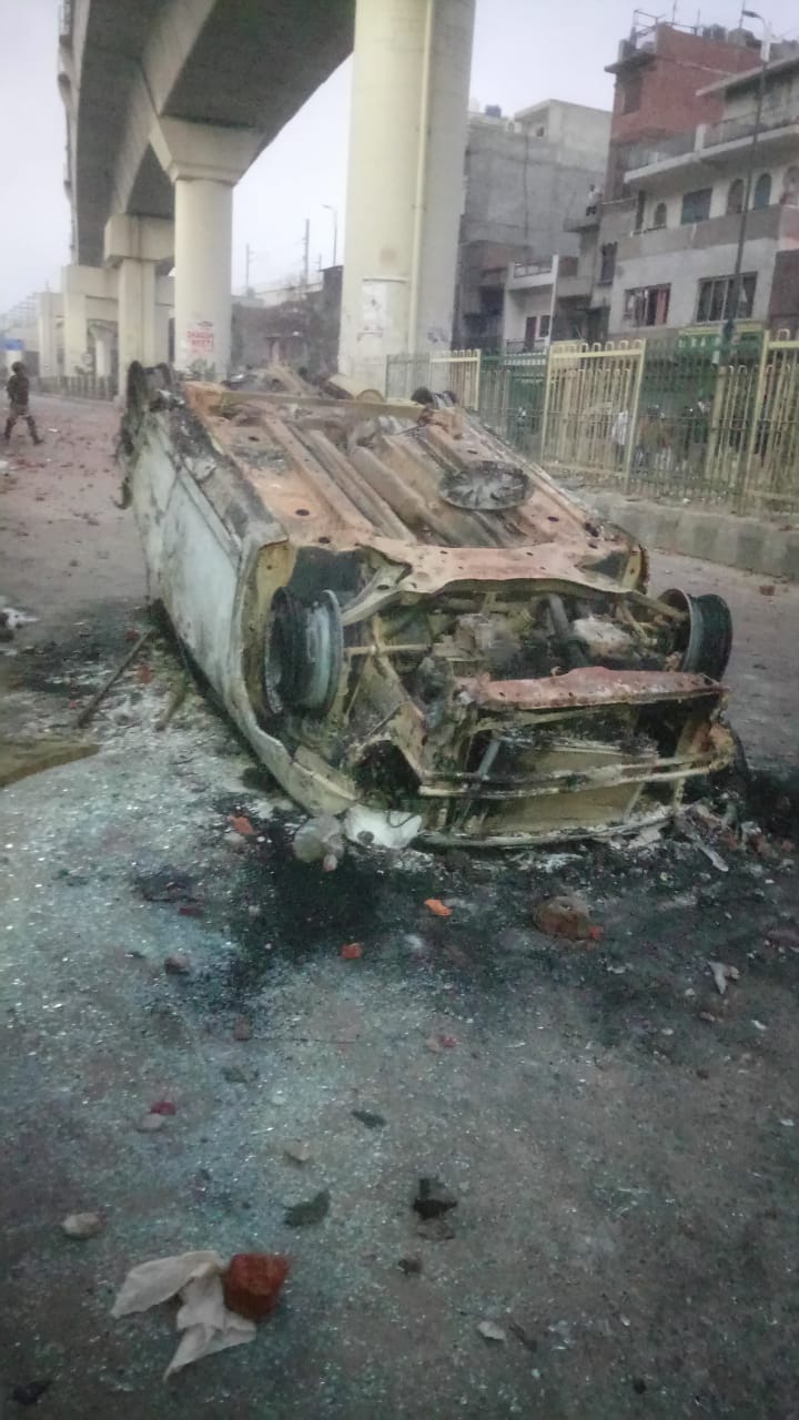 A burnt vehicle on he 500 metre stretch between Jaffrabad and Maujpur.
