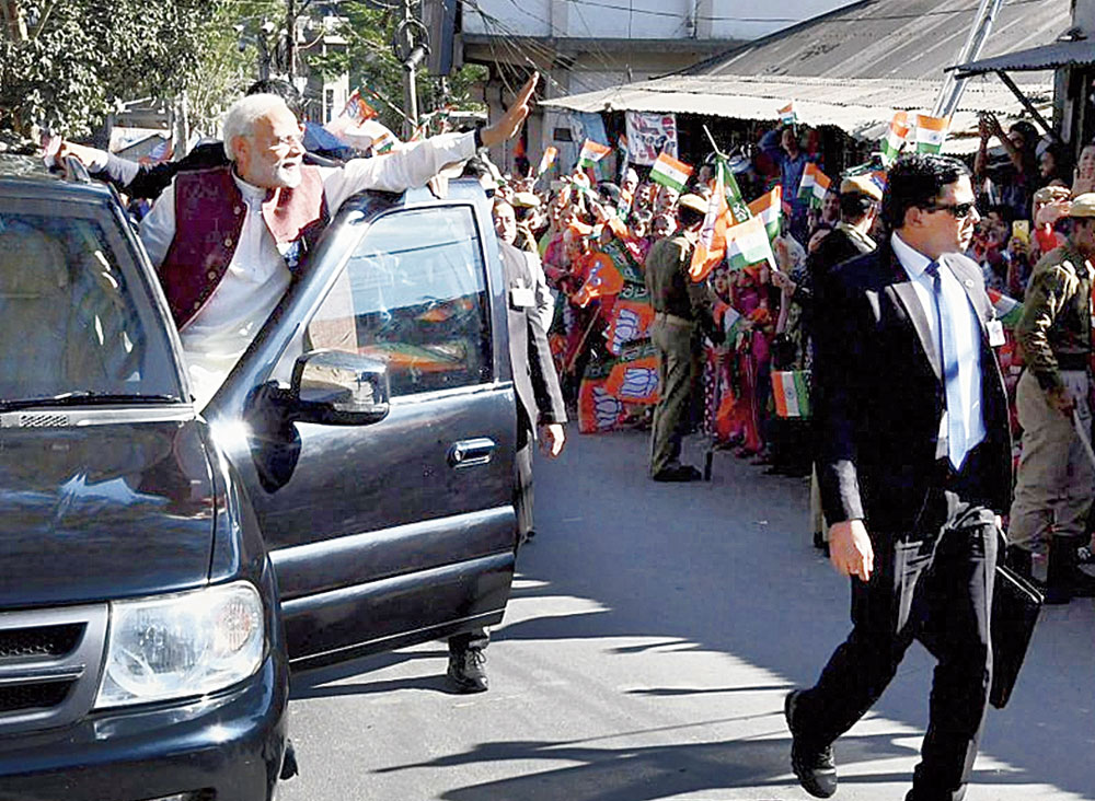 Prime Minister Narendra Modi during the roadshow in Aizawl on Friday. 