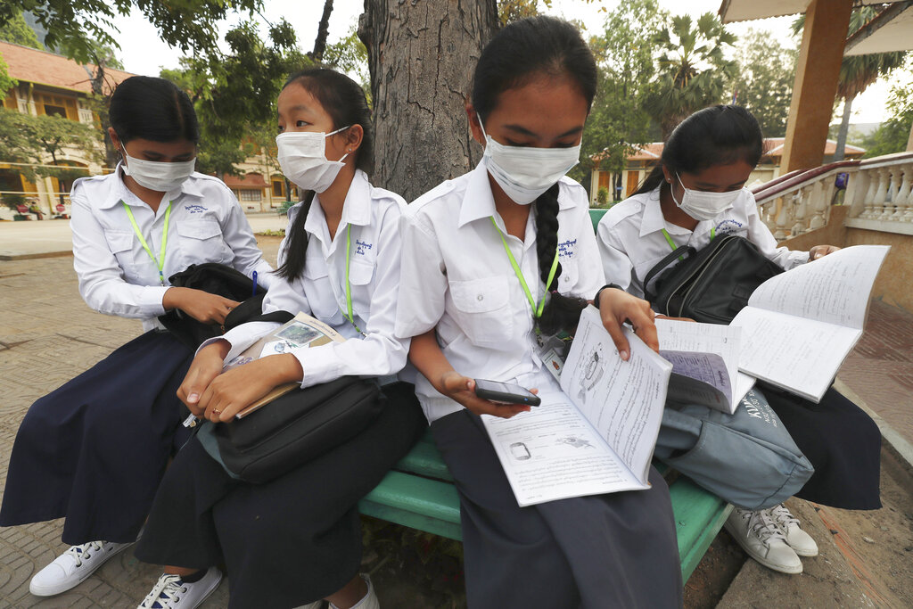 Students wear masks to avoid the contact of coronavirus before their morning class at a high school in Phnom Penh, Cambodia, Tuesday, January 28, 2020.