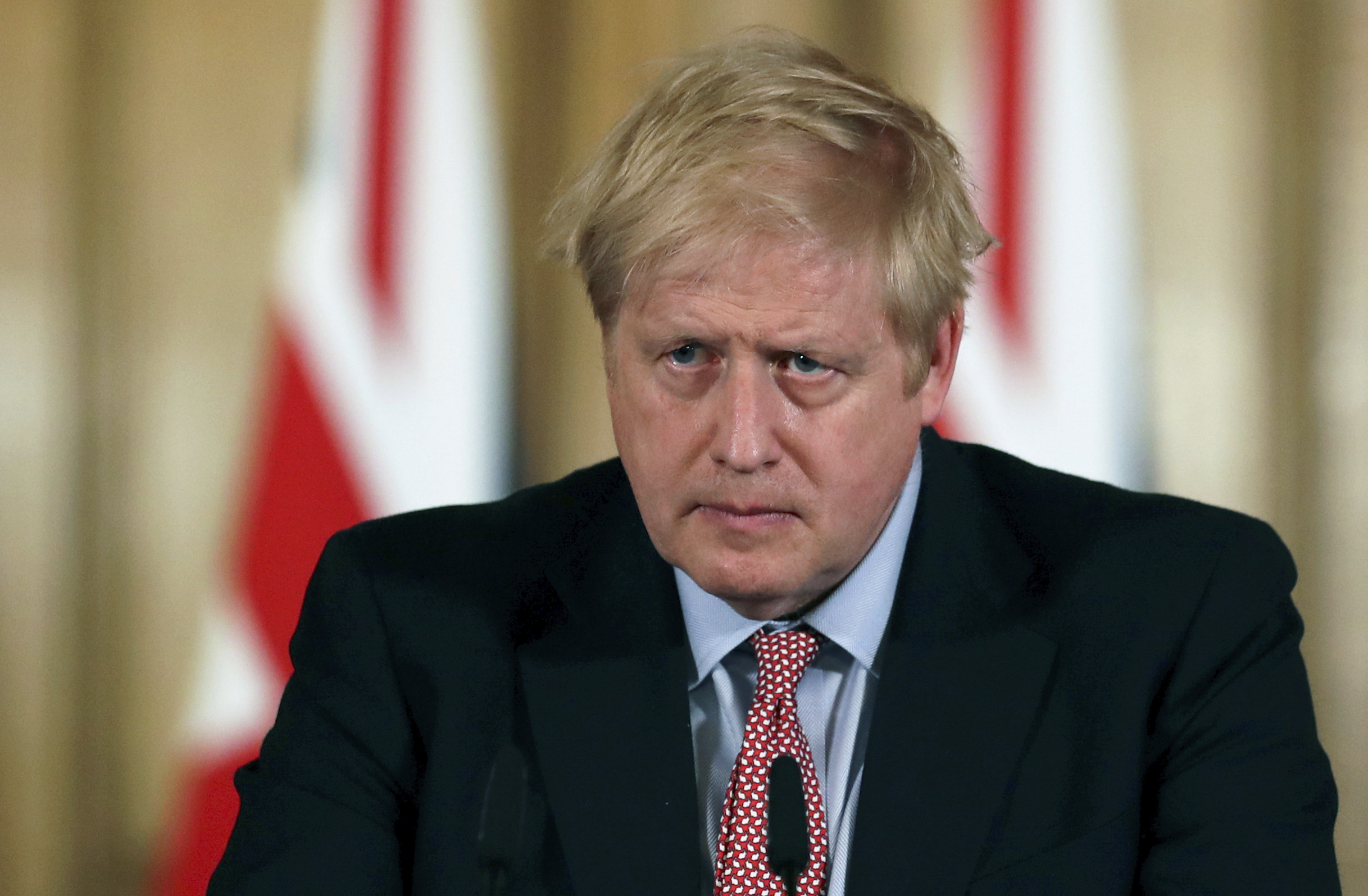 Britain's Prime Minister Boris Johnson holds a news conference to give the government's response to the new Covid-19 coronavirus outbreak, at Downing Street in London.