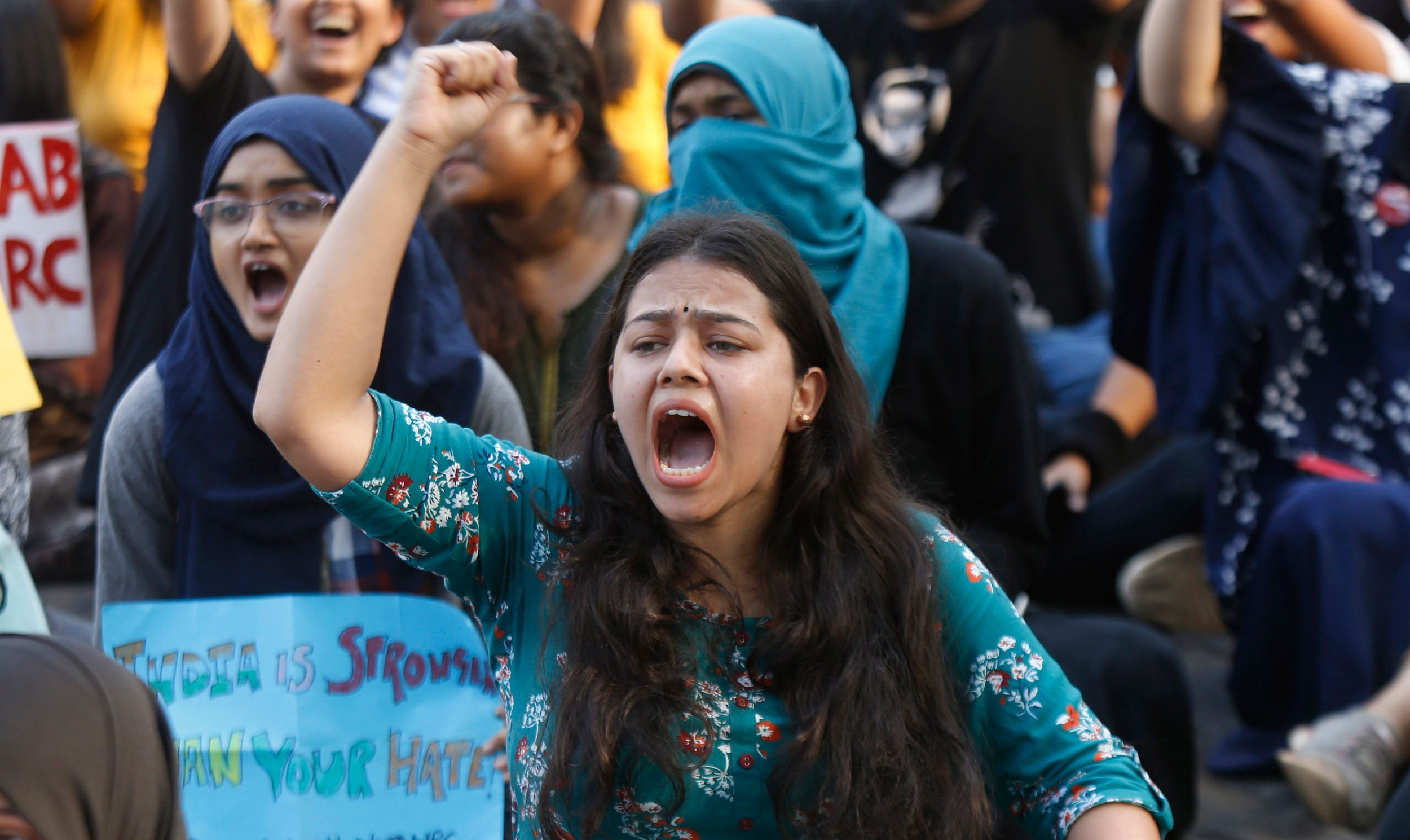 A young woman shouts slogans at a protest against the amended citizenship law at August Kranti Maidan in Mumbai on Thursday. The ground from where Mahatma Gandhi had in 1942 told the British to “Quit India” was packed with protesters on a weekday in a city with a reputation for indifference. Freedom fighter G.G. Parikh, 94, who had participated in the Quit India movement, was at the ground. As were students, political workers and celebrities. Some protesters held up placards saying they were proud of Mumbai police for showing how a peaceful protest can be enabled.
