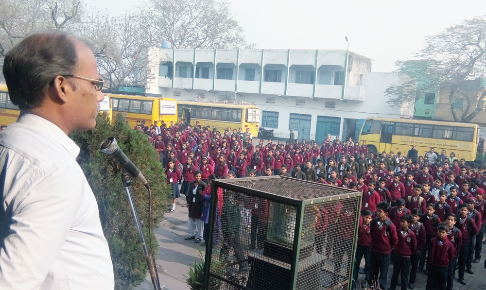 Physiotherapist Dr Manoj Singh addresses the schoolchildren during the morning assembly at Indian School of Learning in Jharia, Dhanbad, on Wednesday. 