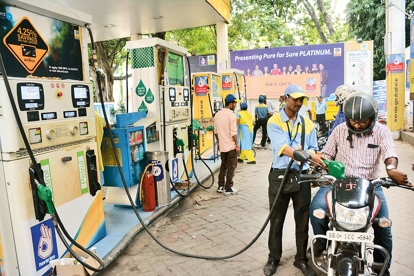 A man refuels his motorcycle at Dakbungalow in Patna on Friday. 