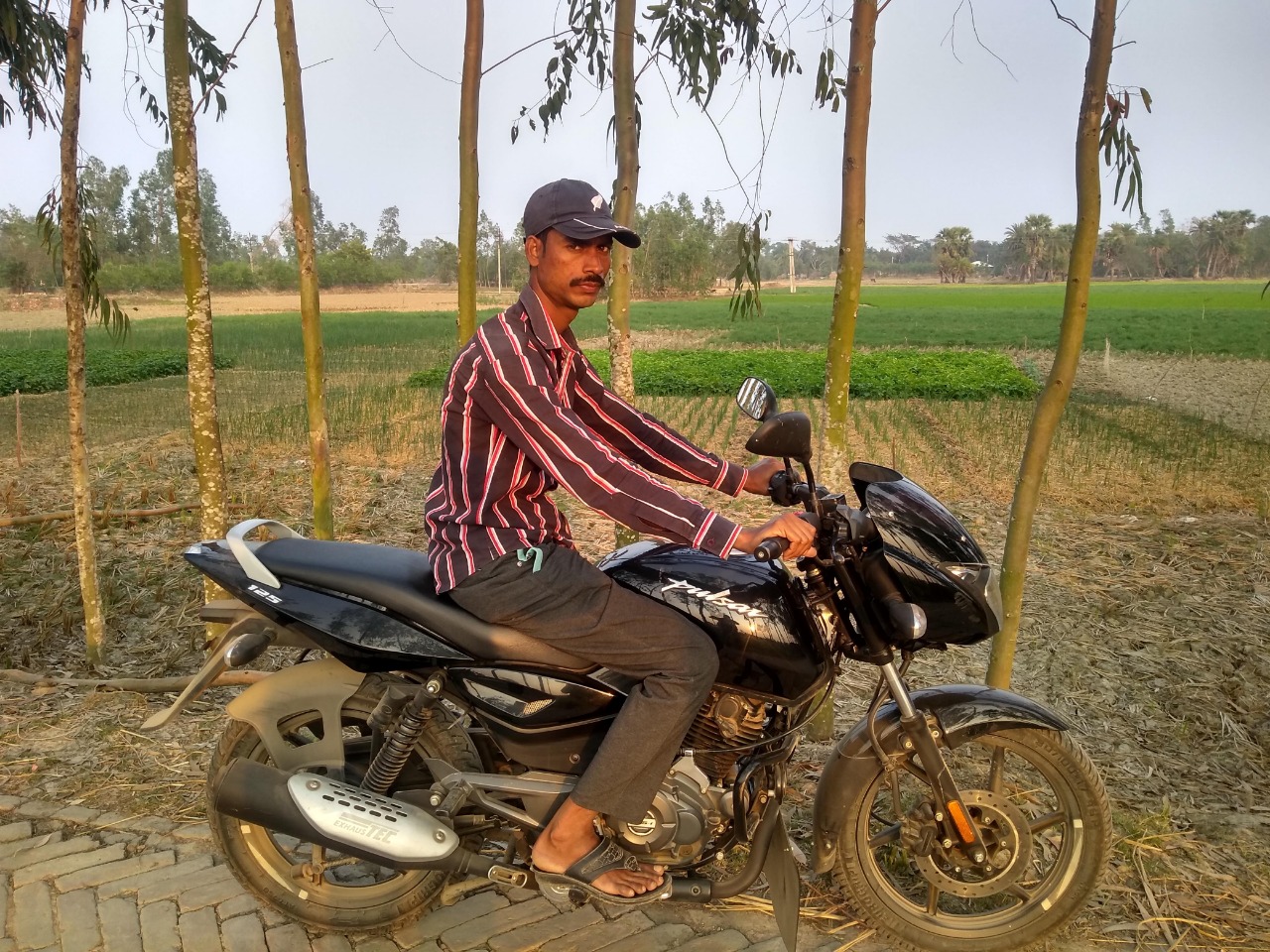 When I visited K-plot in February, Alauddin was waiting with his latest acquisition, a motorbike