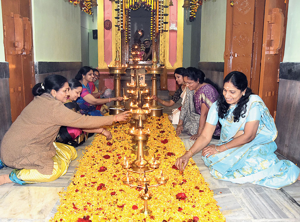 Fragrant festival: Devotees light diyas and make a floral rangoli at the Ayyappa temple in Jagjivan Nagar, Dhanbad, on Makar Sankranti Monday. The day is celebrated in Kerala’s Sabarimala where the Makara Jyothi, the sun’s transit to Capricorn constellation, is said to be visible.