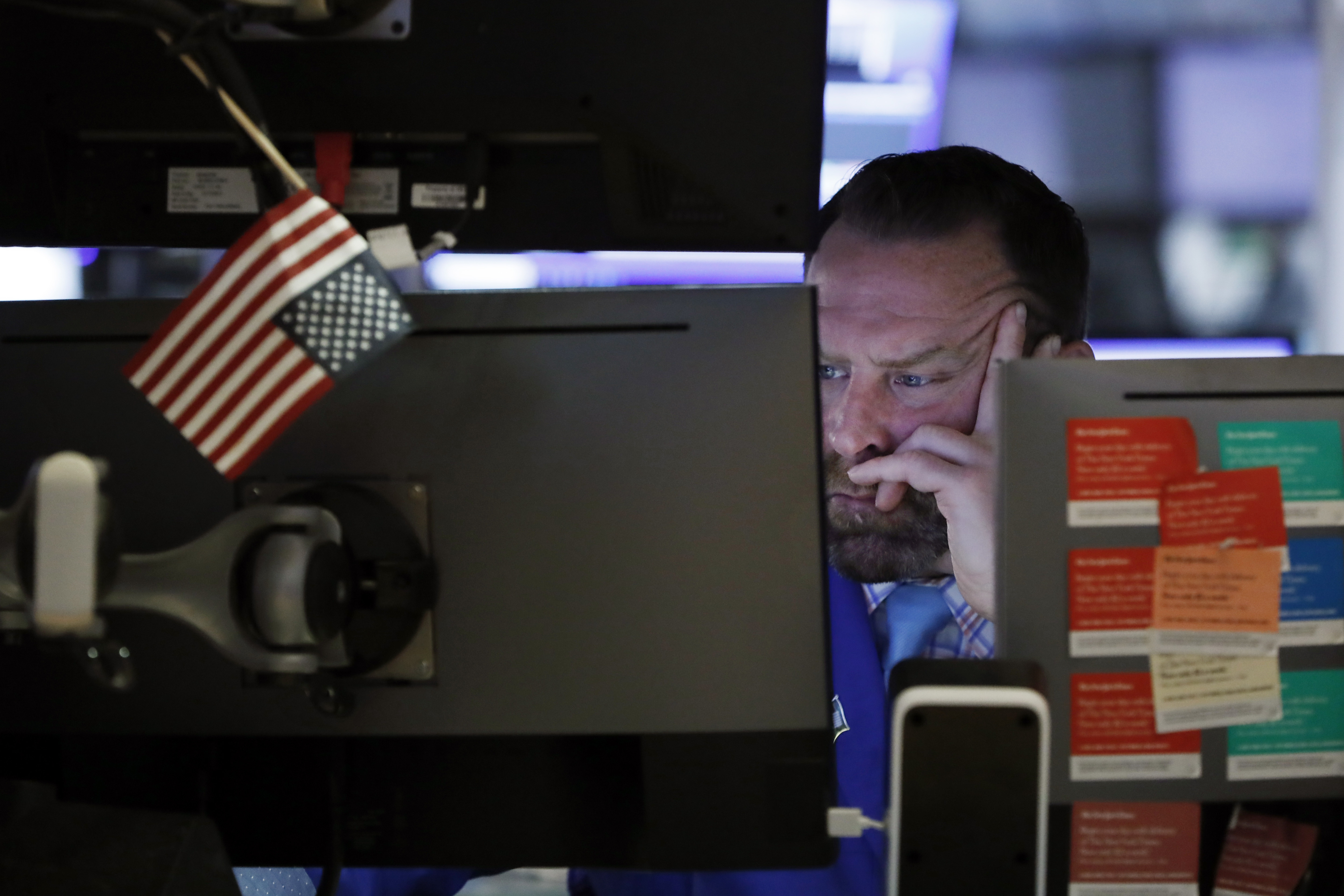 A trader works on the floor at the New York Stock Exchange on Tuesday.
