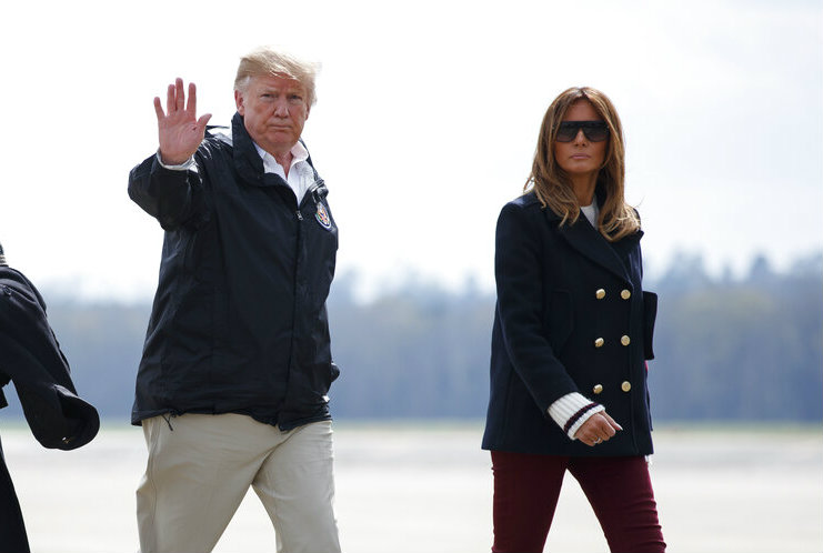 Donald Trump and Melania Trump walk from Marine One to board Air Force One en route Palm Beach International Airport in West Palm Beach, Florida on Friday.