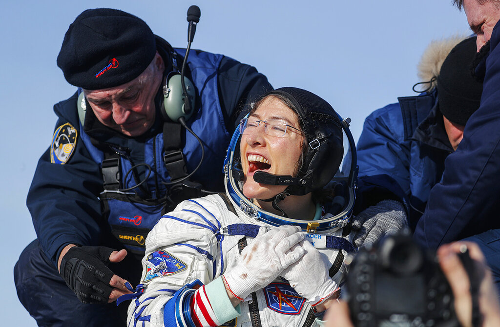 U.S. astronaut Christina Koch reacts shortly after the landing of the Russian Soyuz MS-13 space capsule about 150 km ( 80 miles) south-east of the Kazakh town of Zhezkazgan, Kazakhstan