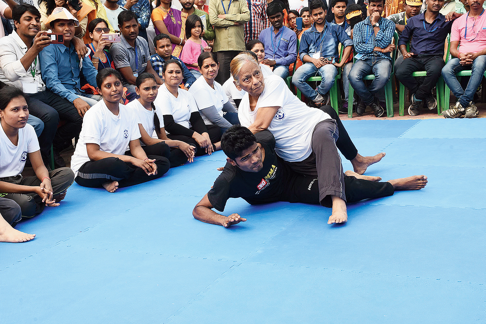 Take that! Jharna Maitra, a 70-year-old resident of EE Block, demonstrates the Kimura wrist lock.