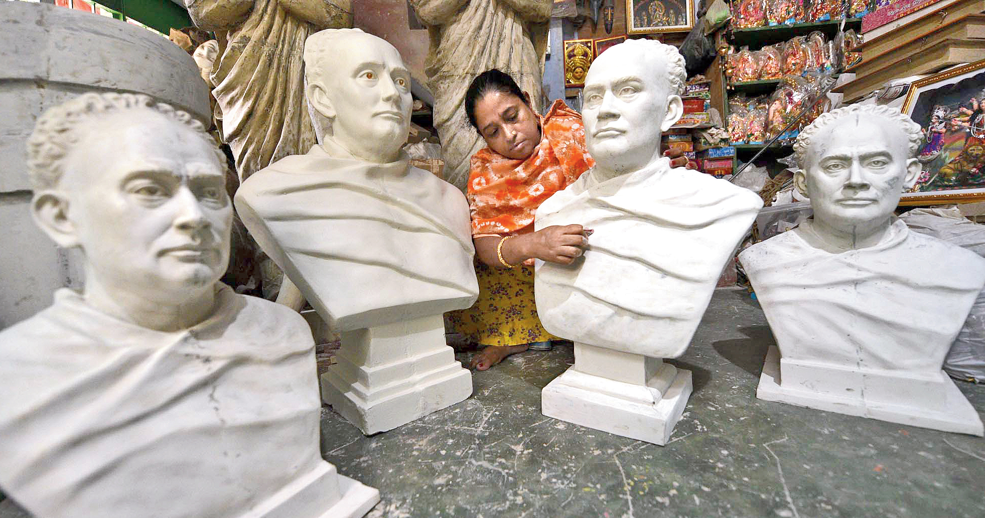 Smritikana Pal with busts of Ishwarchandra Vidyasagar at her workshop in Kumartuli. 
