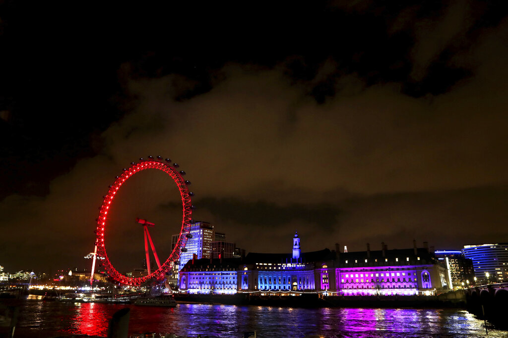 London Eye and other buildings on the south bank of the River Thames, illuminated in central London, England