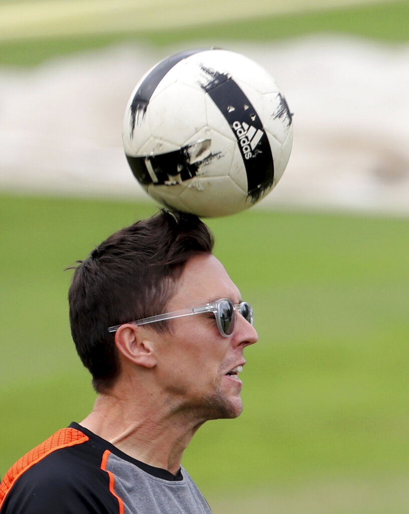New Zealand's Trent Boult heads a soccer ball during a training session ahead of the Cricket World Cup final match against England at Lord's cricket ground in London, England, Saturday, July 13, 2019.