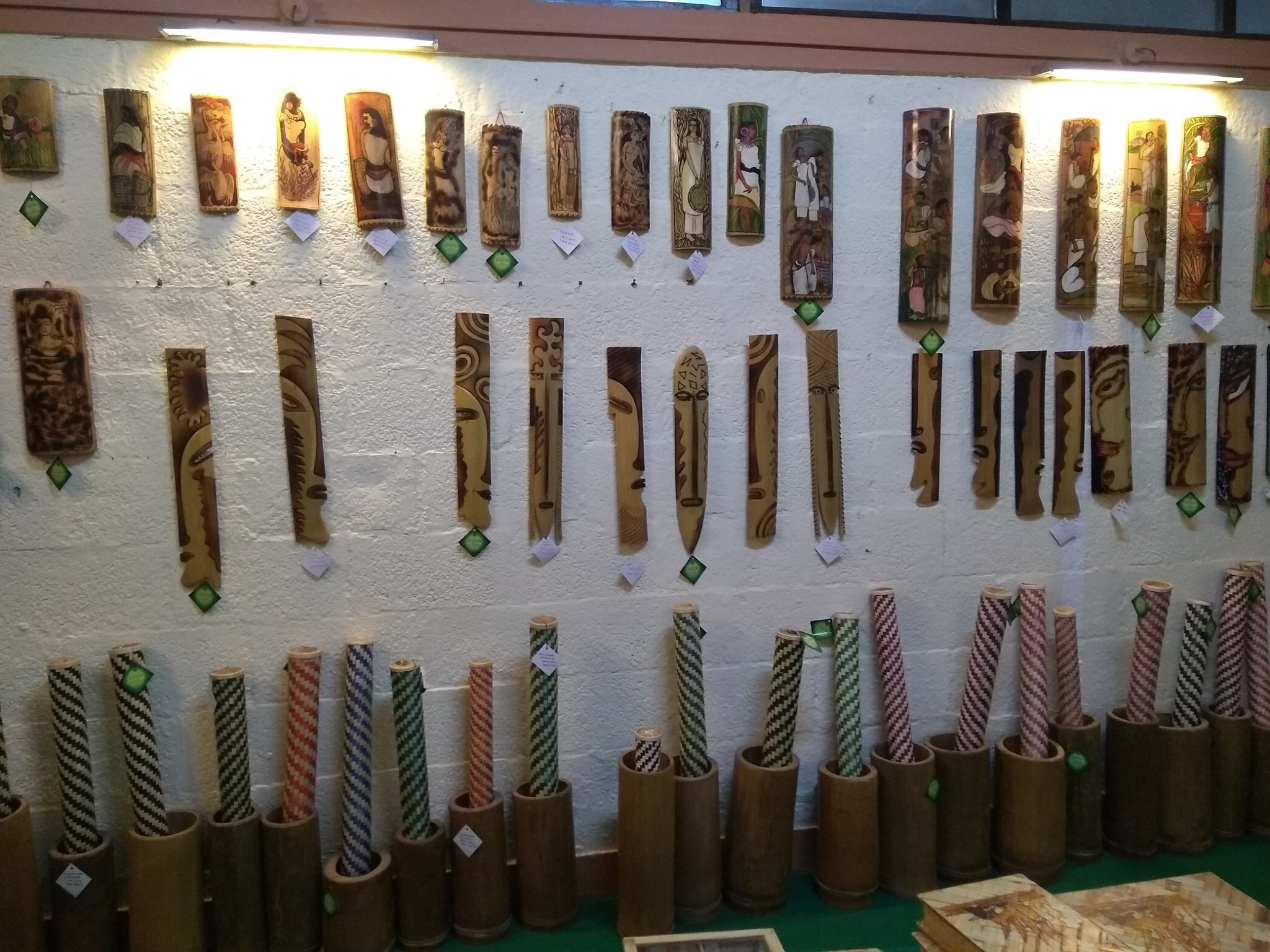 Bamboo products in Uravu, including rainmakers lined up on the floor