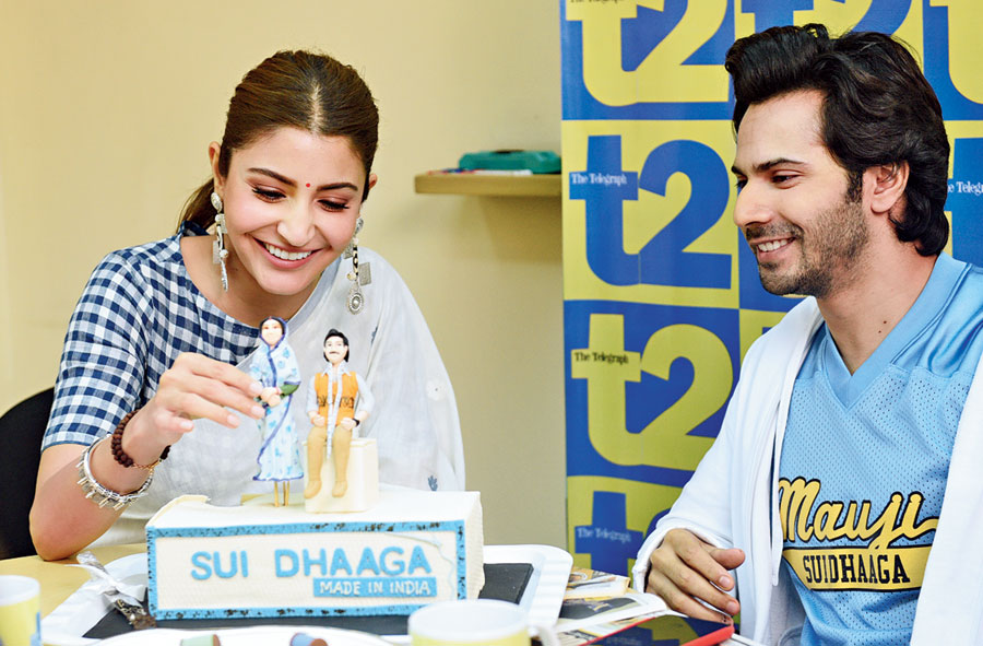 tall tales: “Let me make her taller than you,” laughed Anushka, picking up ‘Mamta’ on the cake. “I am still on a pedestal!” laughed Varun.