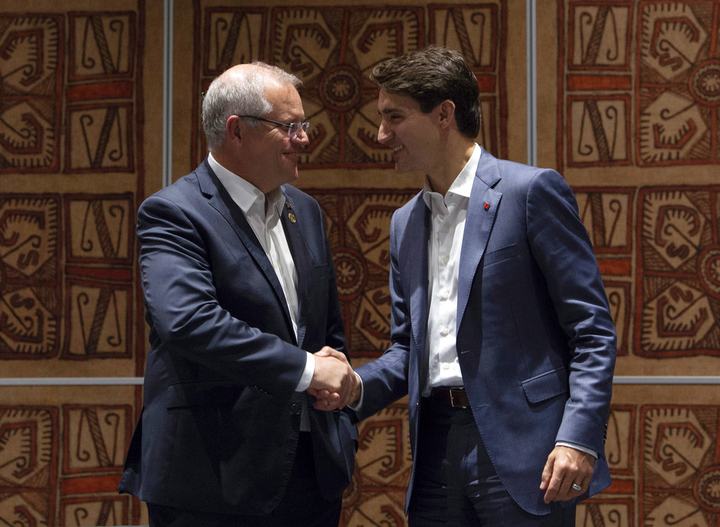 Canadian Prime Minister Justin Trudeau (right) with Australian Prime Minister Scott Morrison at the APEC summit in Port Moresby, Papua New Guinea, on Sunday.