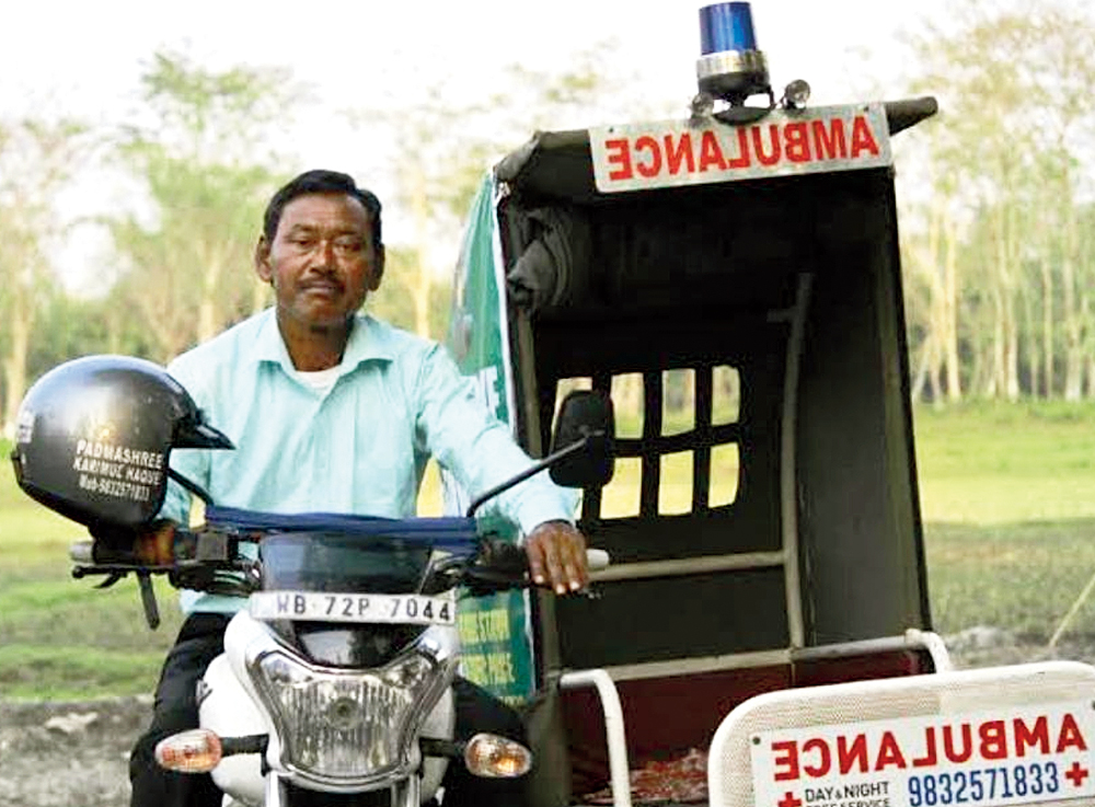 Karimul Haque with his bike ‘ambulance'.
