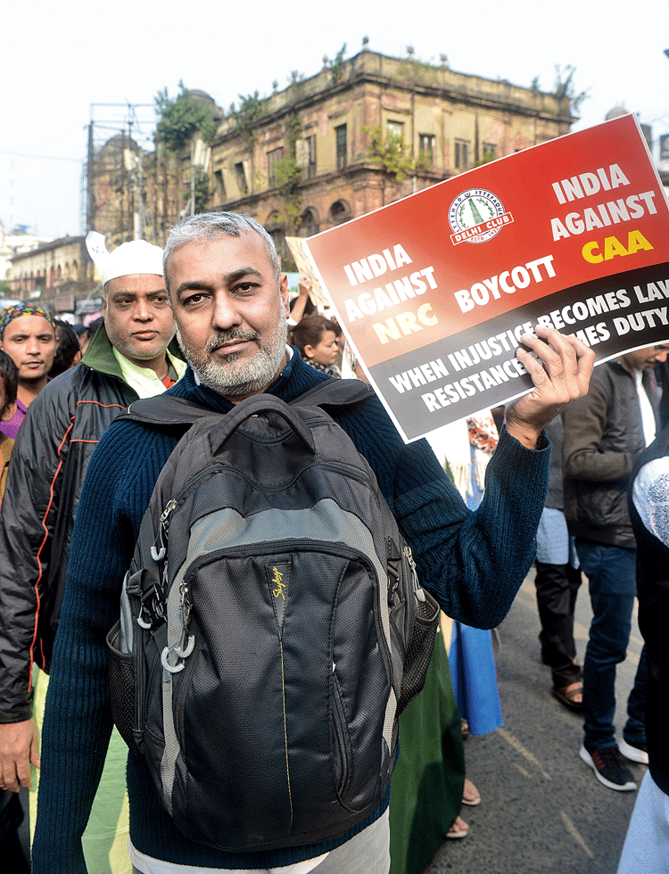 Gulzar, a businessman from Gujarat who made Calcutta his home four years ago, was at the march holding an 
anti-CAA poster