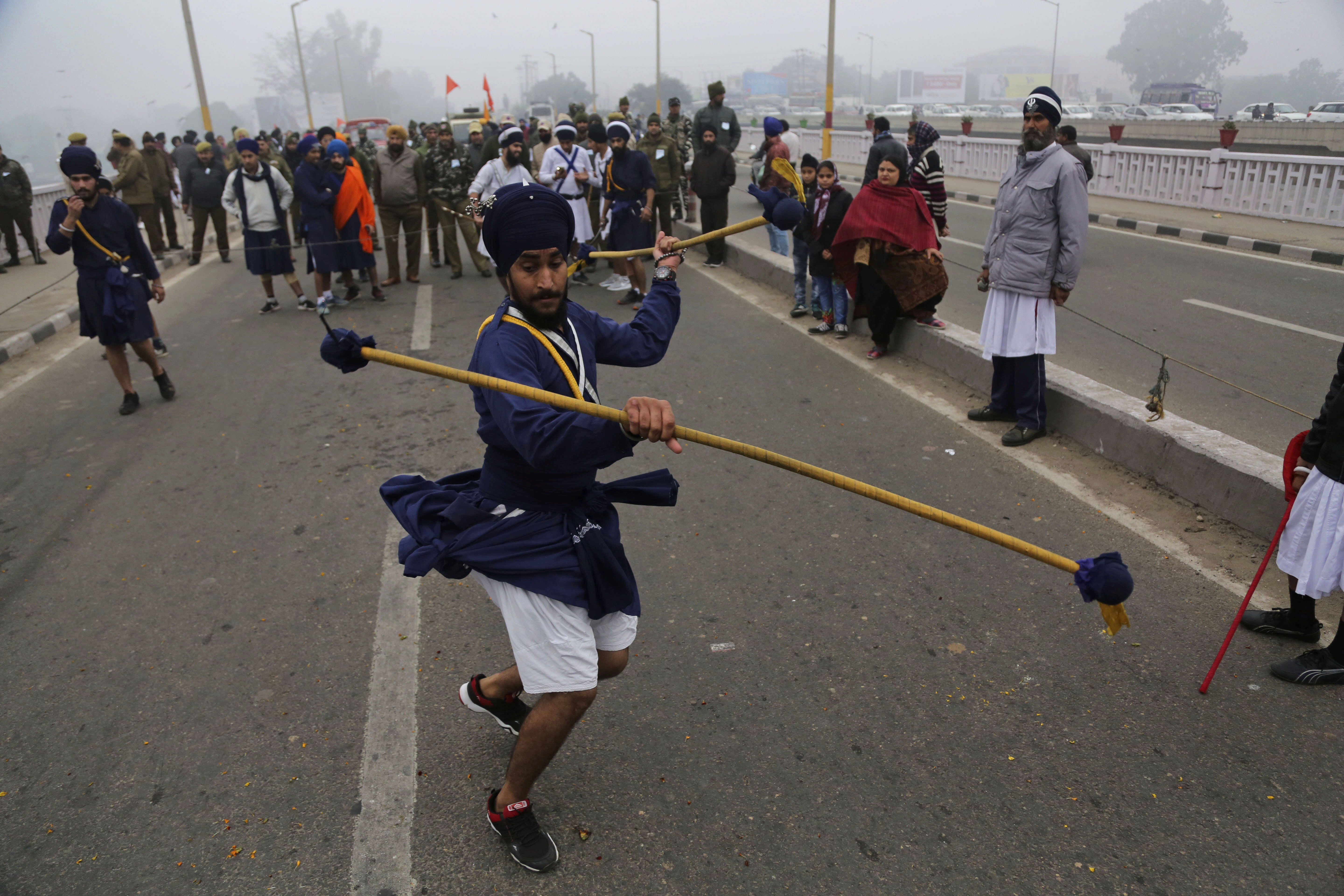 An Indian Sikh warrior displays traditional martial art skills during a religious procession ahead of the birth anniversary of Guru Gobind Singh in Jammu, India, on December 30, 2019. The birth anniversary of the tenth Sikh guru, will be marked on Jan.2