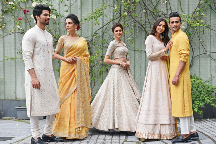 (L-R) Mohammed Iqbal got into an ivory chikan kurta with mukaish work, designed with jadau buttons, and teamed it with ivory pants. Riya Bhattacherjee looked bright and festive in the mango yellow silk sari with gota patti, pearl work and metal sequins. Classy, elegant and graceful was Jessica Aaron in a silver Benarasi lehnga designed with pearl work, gota patti and metallic sequins with the perfect amount of shine and shimmer. Diti Saha channelled a dewy-fresh look in the chikan Anarkali paired with a crushed cotton skirt designed with golden gota work at the hemline and a bright yellow bandhni dupatta embellished with pearls, metal sequins and aari work. Sonu Kumar was wedding party ready in a yellow georgette chikan kurta with mukaish work and paired with ivory handloom cotton pants.