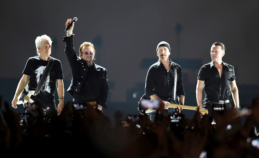 Irish rock band U2 singer Bono with band members performs during a concert, in Navi Mumbai, on December 15, 2019.