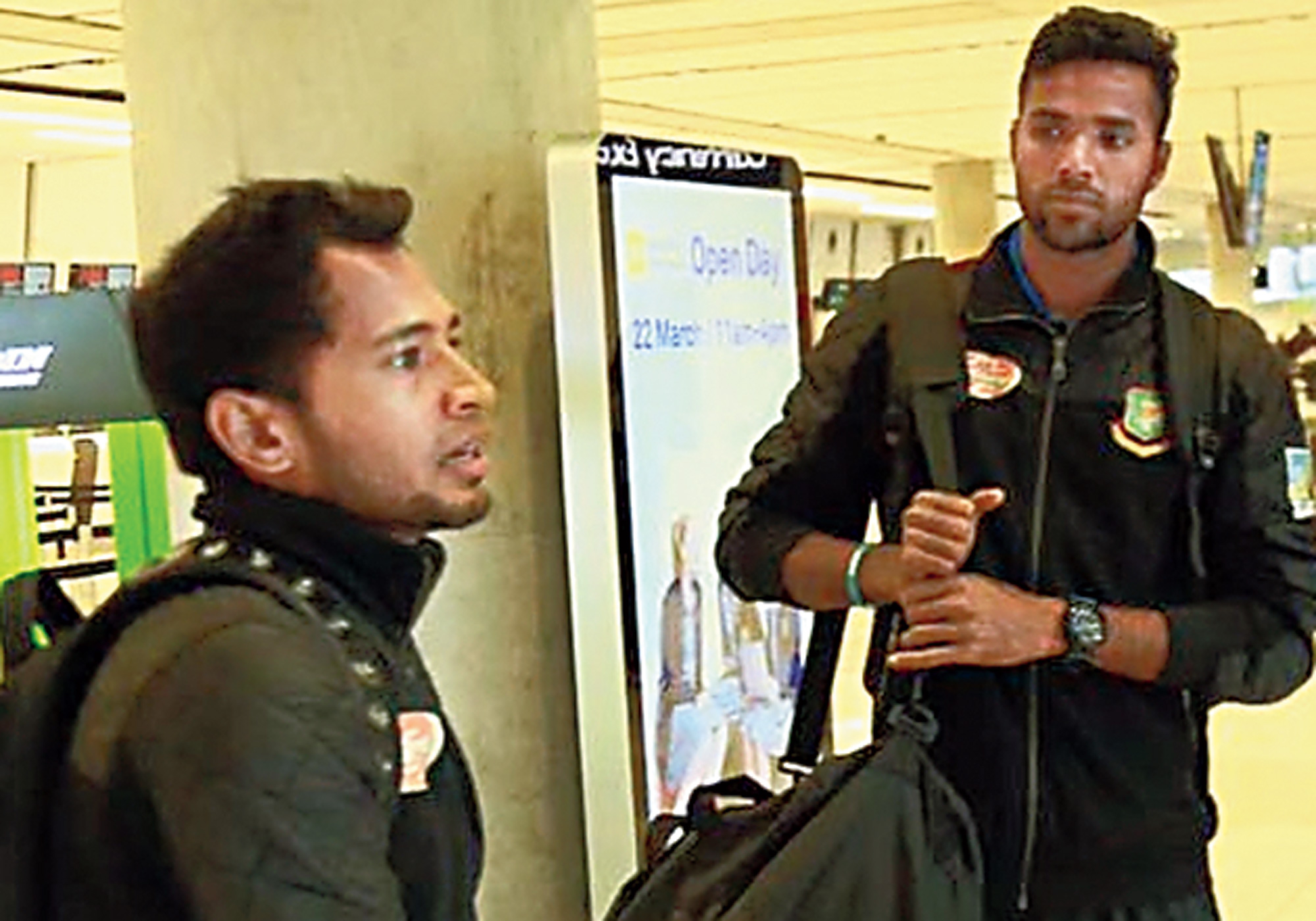 Mushfiqur Rahim with a teammate on arrival at the Dhaka airport on Saturday.