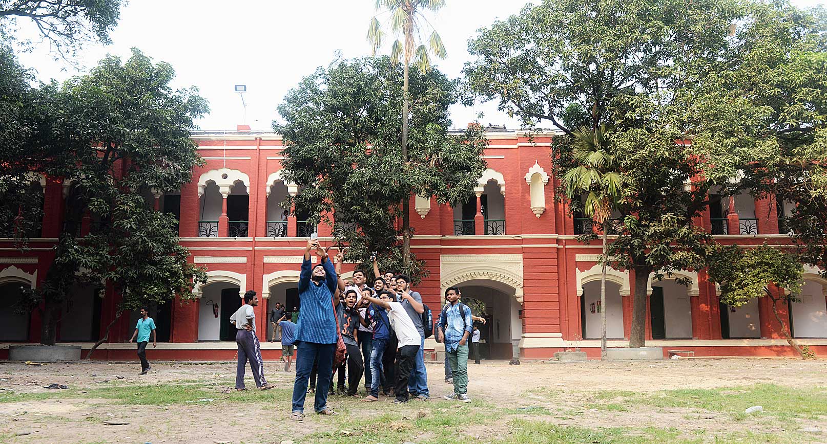 Students take a groupfie on the hostel premises after Presidency University allowed them in Building I on Monday. 
