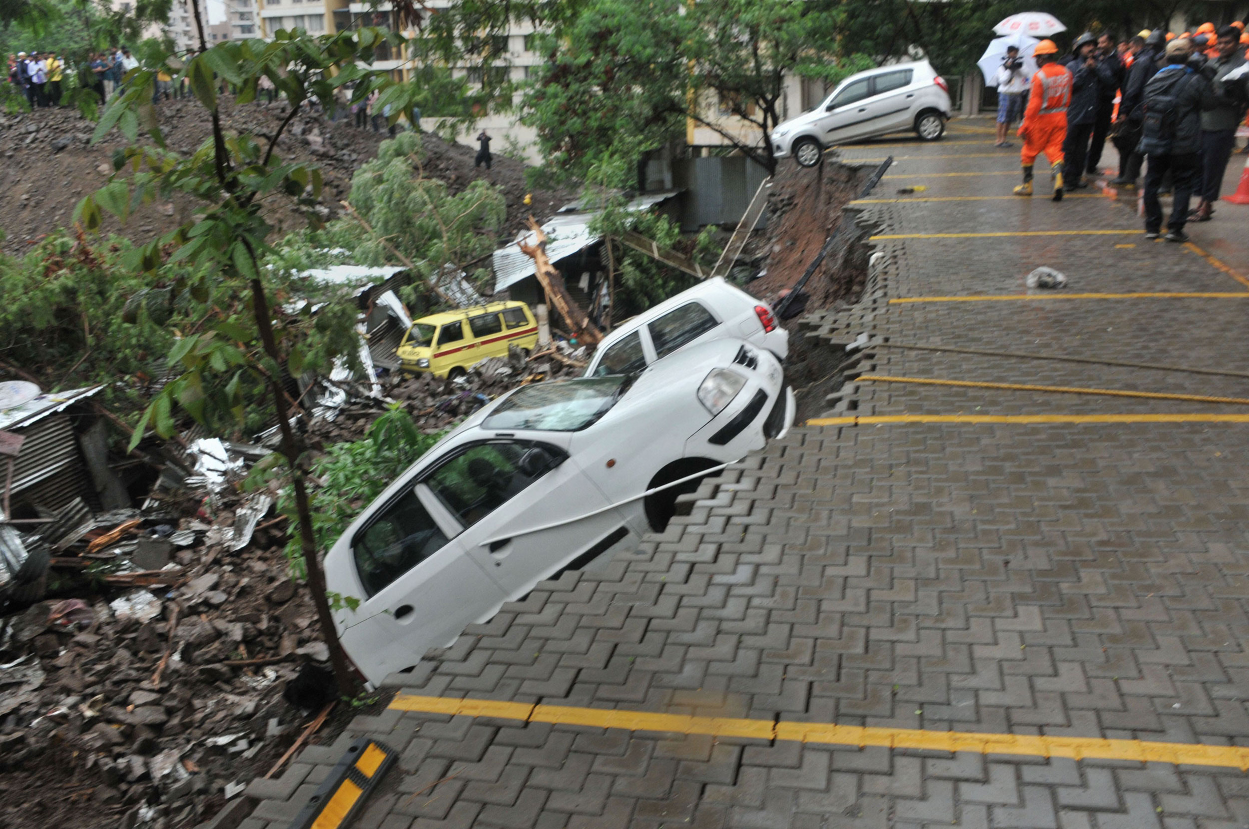 A damaged car at the collapse site in Pune on Saturday.