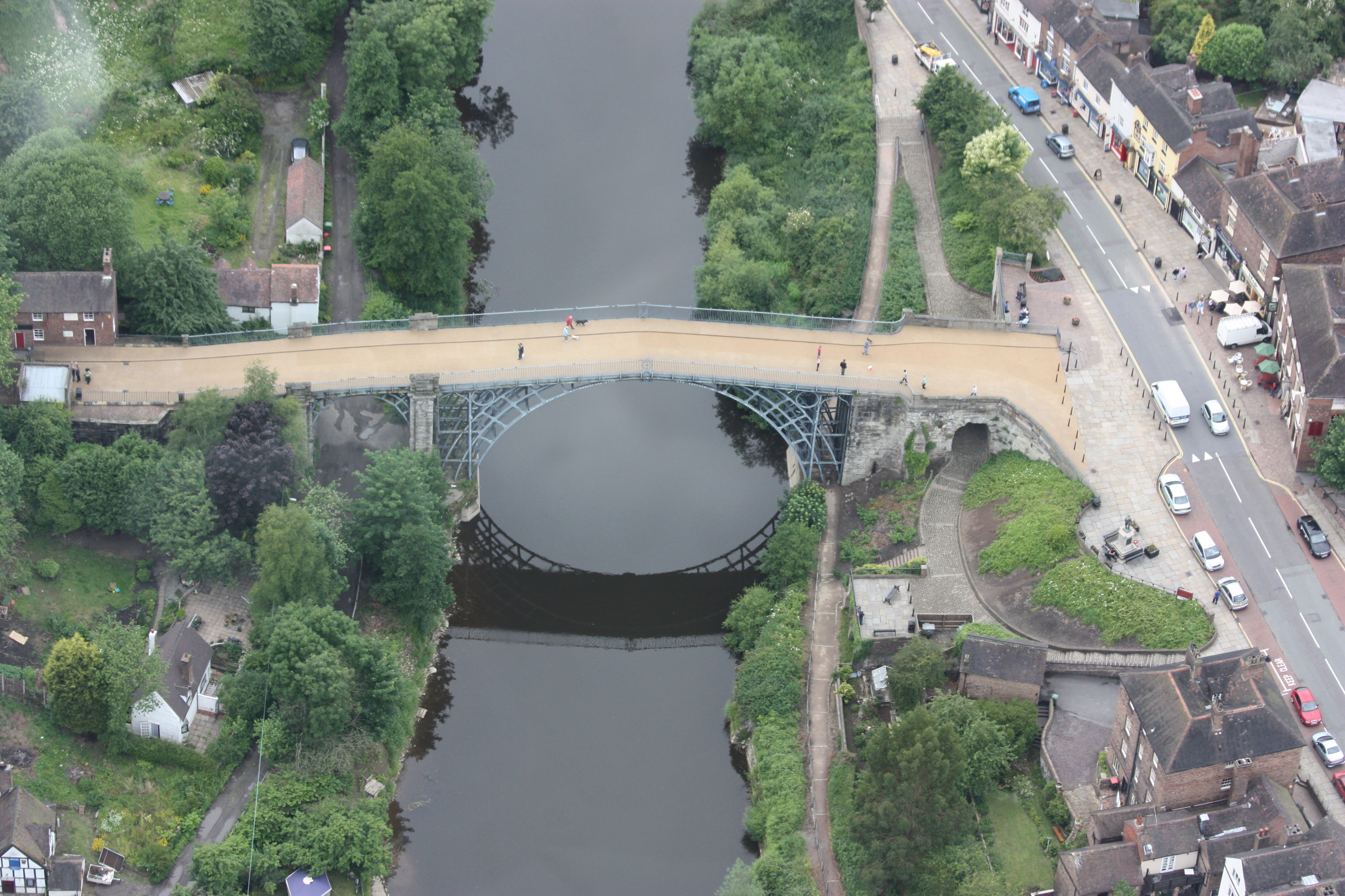 The first iron bridge, built at Coalbrookdale, England, in 1781. Its engineers used the same design they would have used for a masonry bridge. Within a hundred years, however, structures were being designed using scientific methods and quantitative design processes that made it possible to predict the performance of the new materials