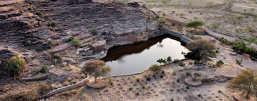 A lake created in an abandoned sandstone mine by harvesting rainwater — a resource for villagers and fauna alike