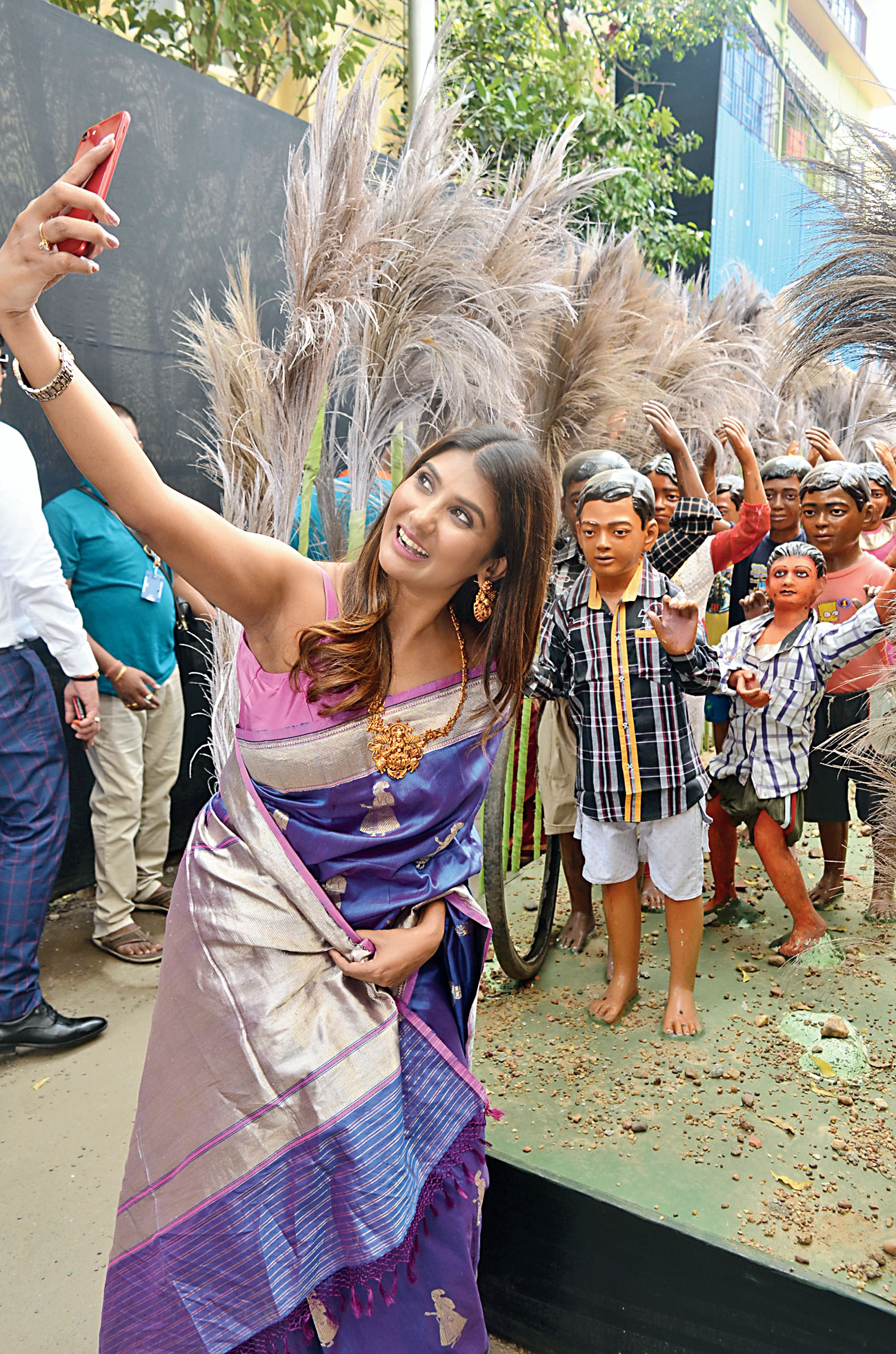 Parno Mittra clicks a festive selfie at the entrance to Dum Dum Tarun Dal