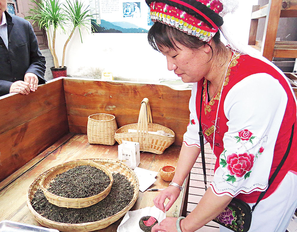 Pu’er tea, a speciality of Yunnan, being moulded