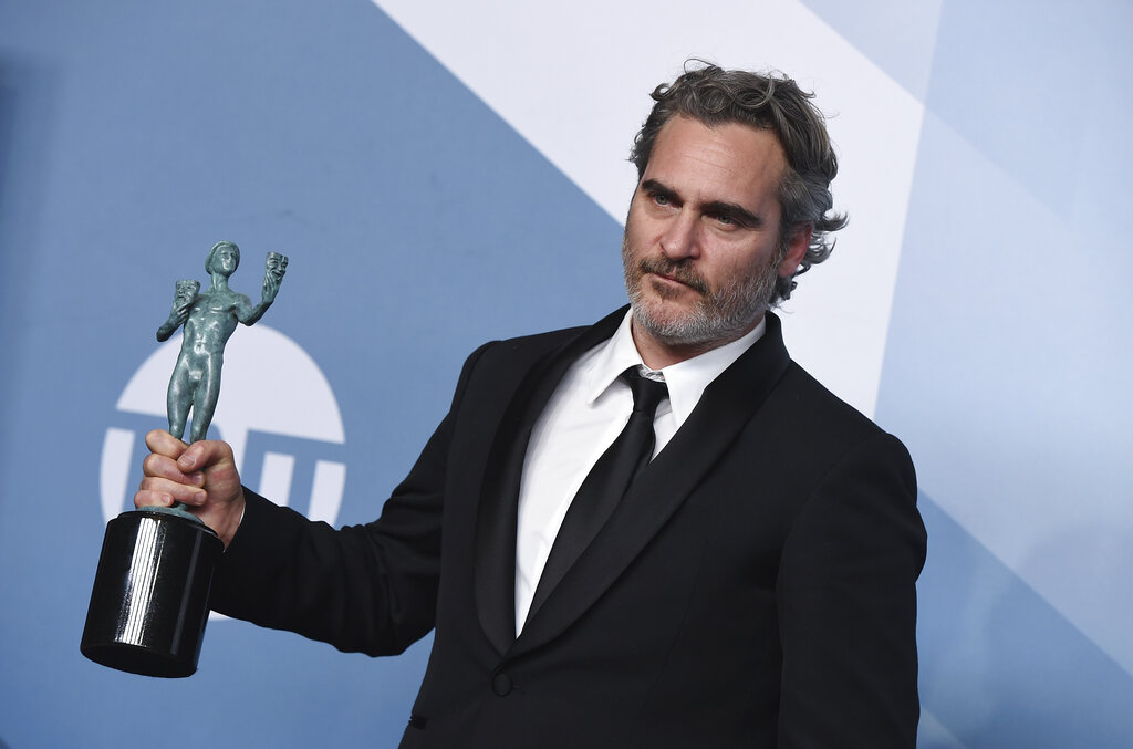 Joaquin Phoenix poses in the press room with the award for outstanding performance by a male actor in a leading role for "Joker" at the 26th annual Screen Actors Guild Awards at the Shrine Auditorium & Expo Hall on Sunday, January 19, 2020, in Los Angeles.
