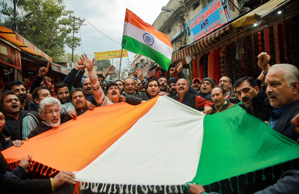 People chant slogans as they celebrate India's major preemptive strike on Jaish-e-Mohammad's camps, in Jammu on Tuesday. 