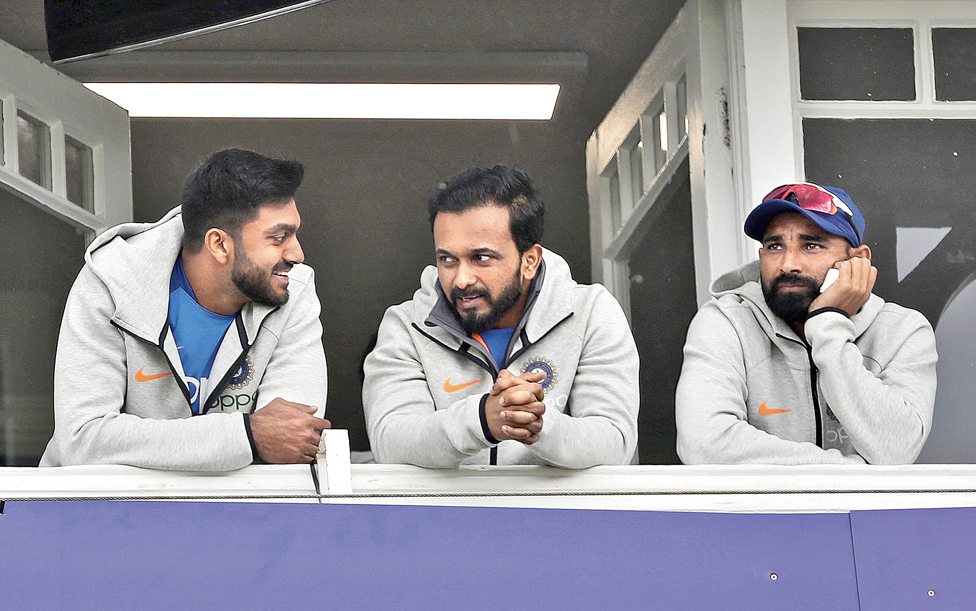 Vijay Shankar (from left), Kedar Jadhav and Mohammed Shami outside the India dressing room at Trent Bridge on Thursday. The World Cup game against New Zealand was abandoned without a ball being bowled. 