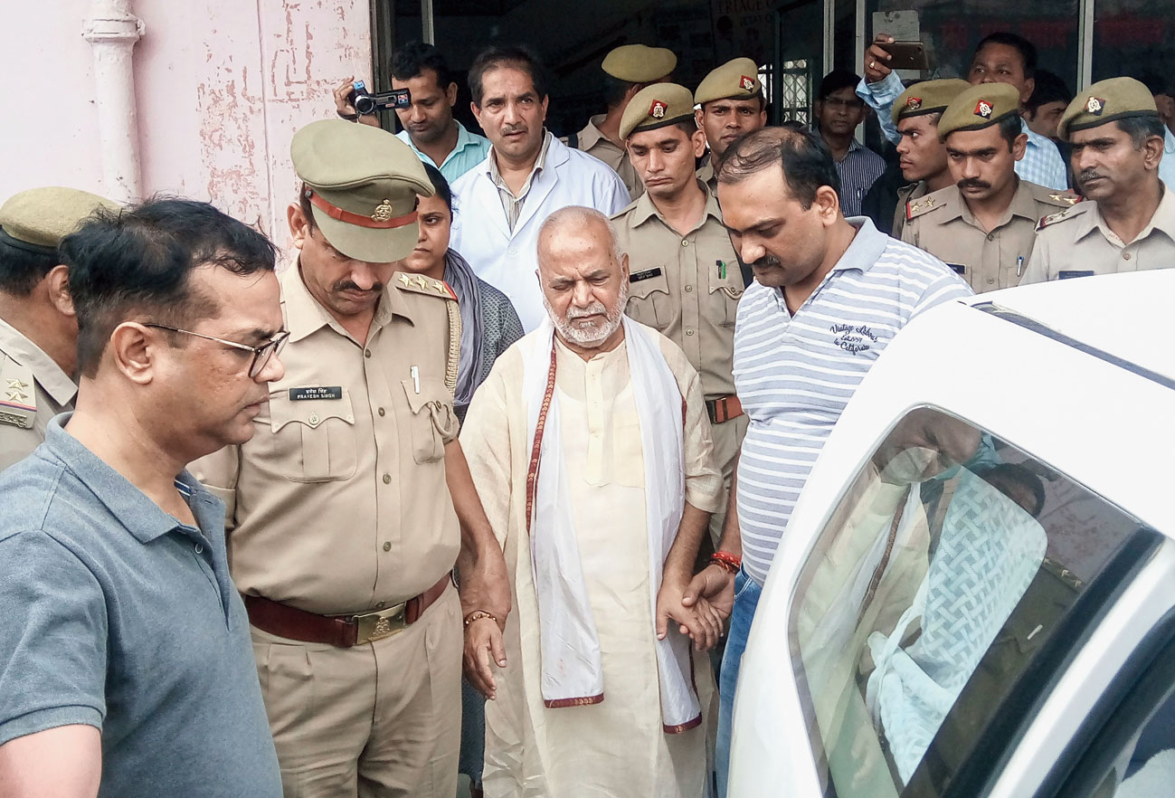 Former Union minister Chinmayanand leaves a government hospital after a medical examination, in Shahjahanpur, Friday, September 20, 2019