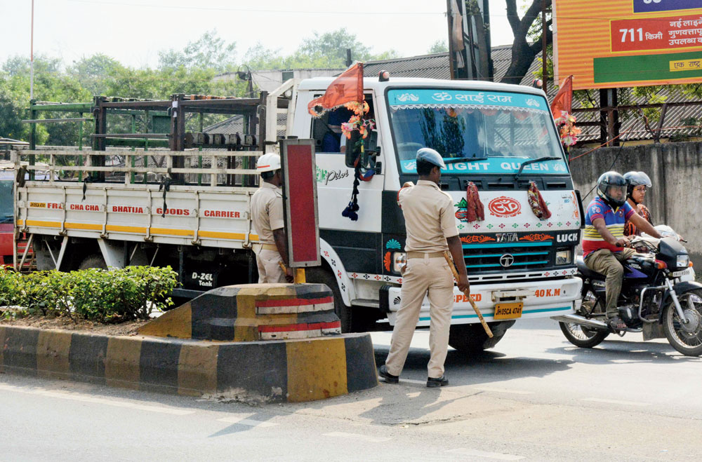 Policemen crack down on road safety offenders in Jugsalai, Jamshedpur, on Tuesday.