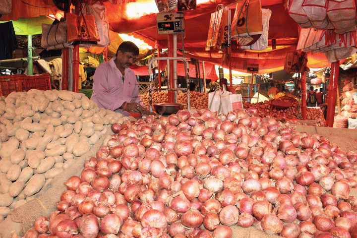 An onion seller at the Sakchi vegetable market in Jamshedpur on Tuesday
