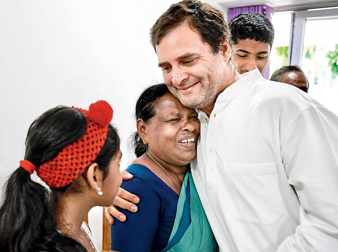 Rahul Gandhi meets former nurse Rajamma Vavathil in Wayanad on Sunday. 
