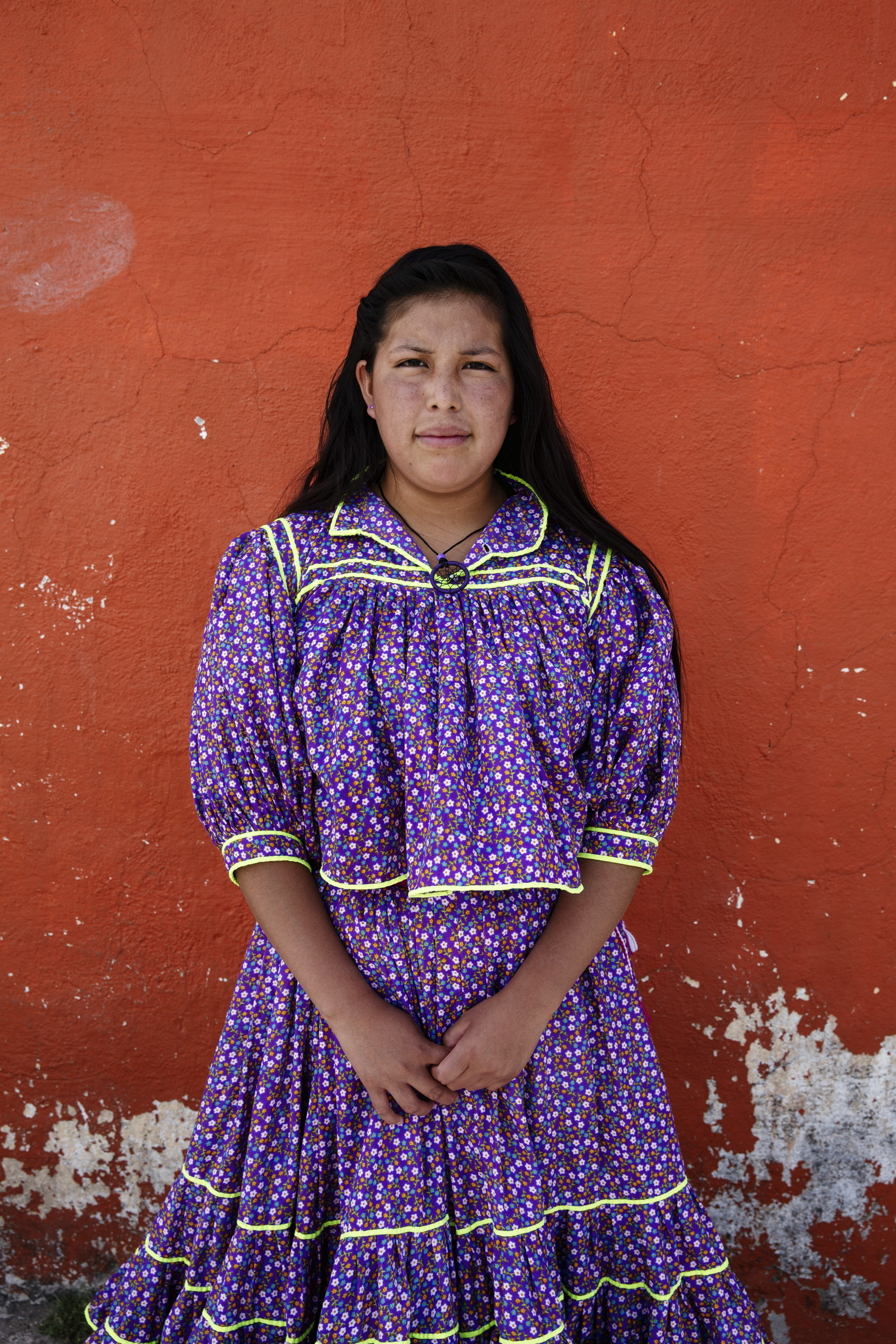 Yulissa Ramirez, a member of the indigenous Rarámuri community, in Chihuahua, Mexico. She plans to attend nursing school after she graduates from high school, where the customary uniform is white scrubs, but hopes the program will allow her to wear a traditional white Rarámuri dress