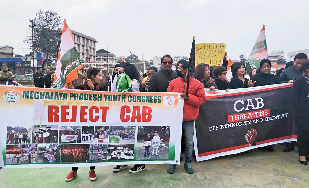 The Meghalaya Pradesh Congress Committee members take part in a rally in Shillong on Thursday