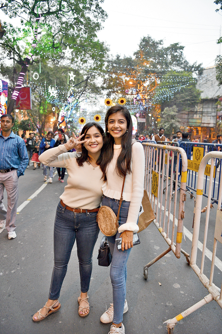 Besties: Sanjibani Sanyal (left) studies biomedicine in the UK. Asmita Yadav is doing biotech in Noida. But the best friends from school have been spending Christmas in Calcutta for four consecutive years now. On Wednesday, they were twinning in white tees and denims and
sunflower headgears.