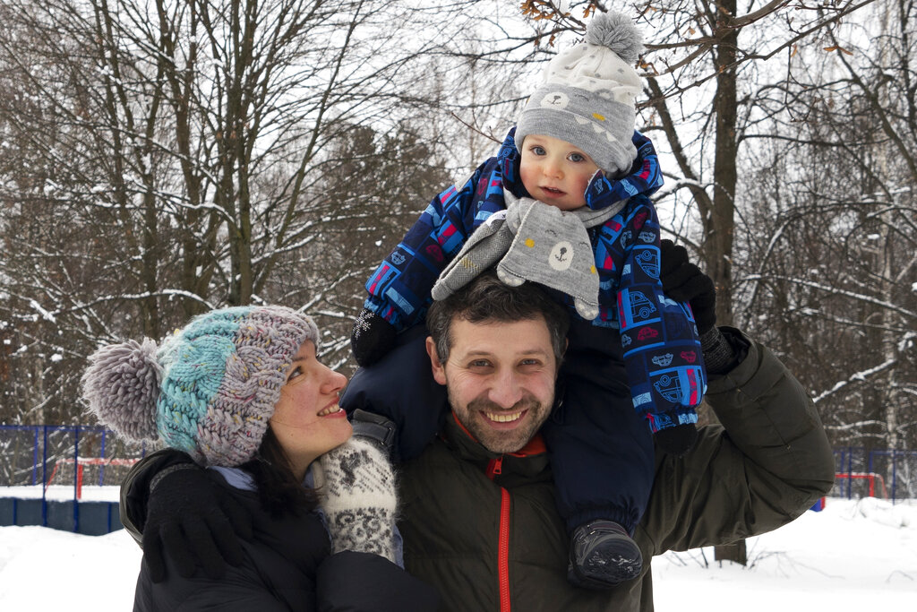Ilya Zhegulev, a journalist for the Latvia-based Russian website Meduza, his son Ivan and his wife Katya in Moscow.