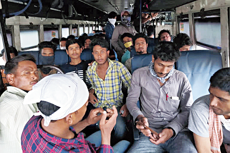 The labourers on the bus that brought them from Calcutta to Chagolia in Dhubri district. 
