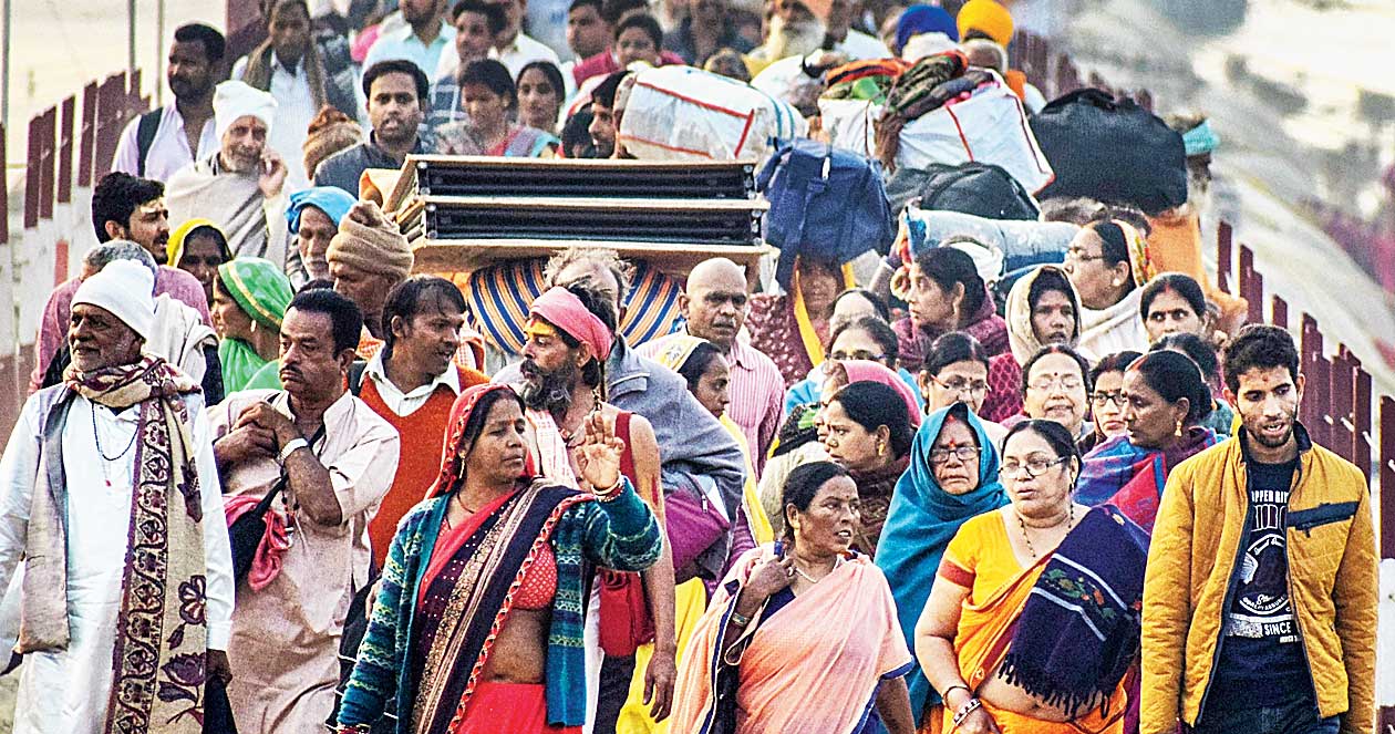 Devotees arrive at the Sangam for the Mauni Amavasya bath during the Ardh Kumbh Mela in Allahabad on Saturday. 
