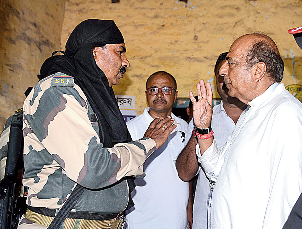 Arjun Singh's rival, Dinesh Trivedi, outside a booth on Monday.