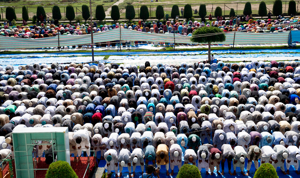 Kashmiris participate in Id prayers outside a mosque during a security lockdown in Srinagar on Monday, August 12, 2019.